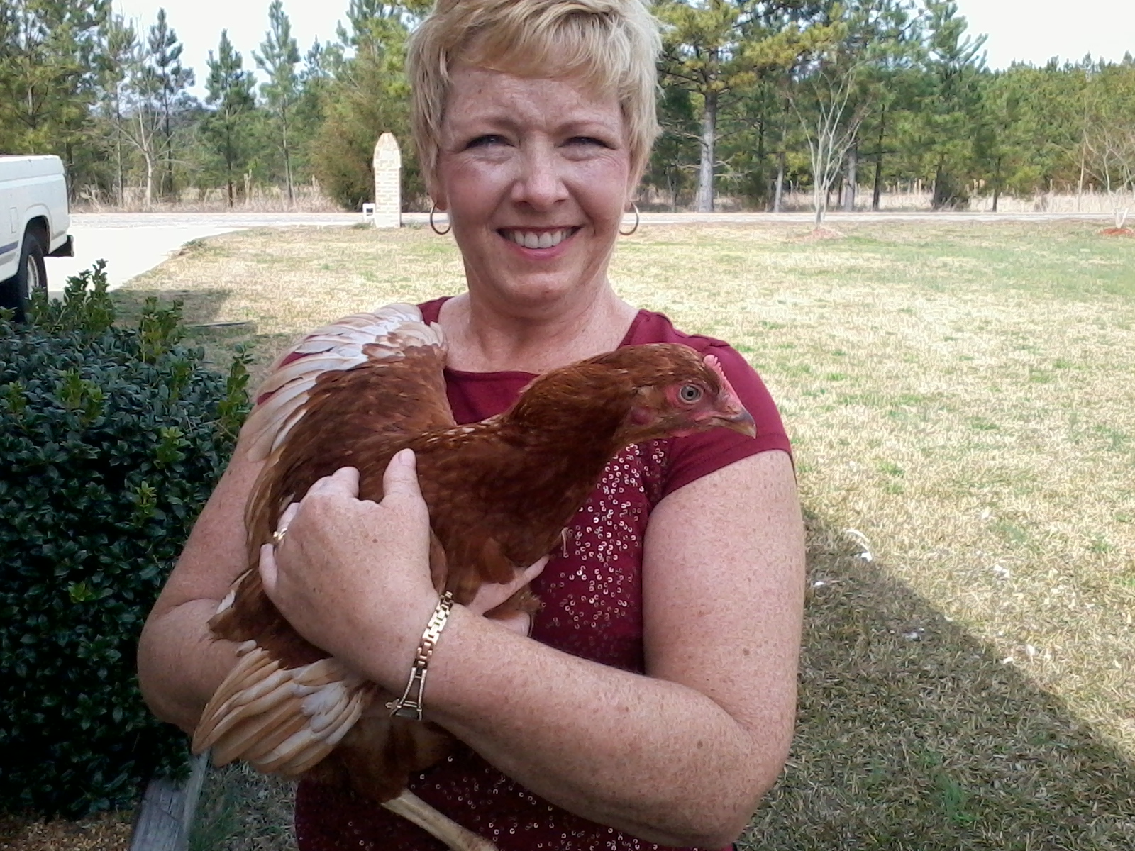 melinda holding a chicken 007